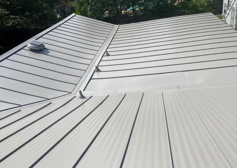 Solar attic fan installed on a metal roof for Roof Ventilation in Pinewood